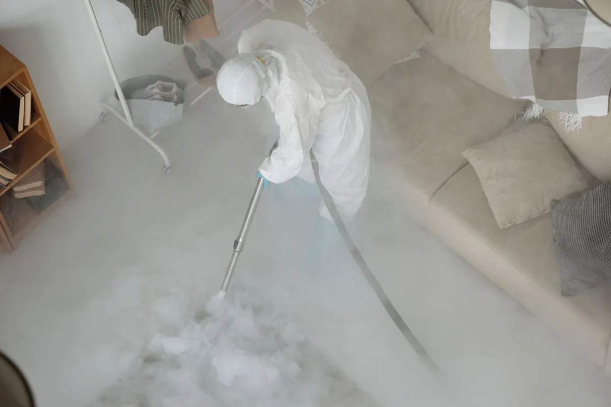 Biohazard cleanup technician in protective equipment, Ecru, MS
